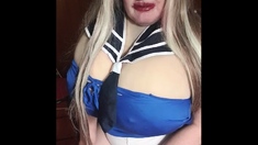 Susi is wearing a sailor outfit sucking giving a toy blowjob