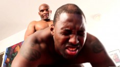 Muscled black studs drop their clothes and engage in hard gay action