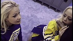 In the locker room, two wonderful cheerleaders get together and share a big dick